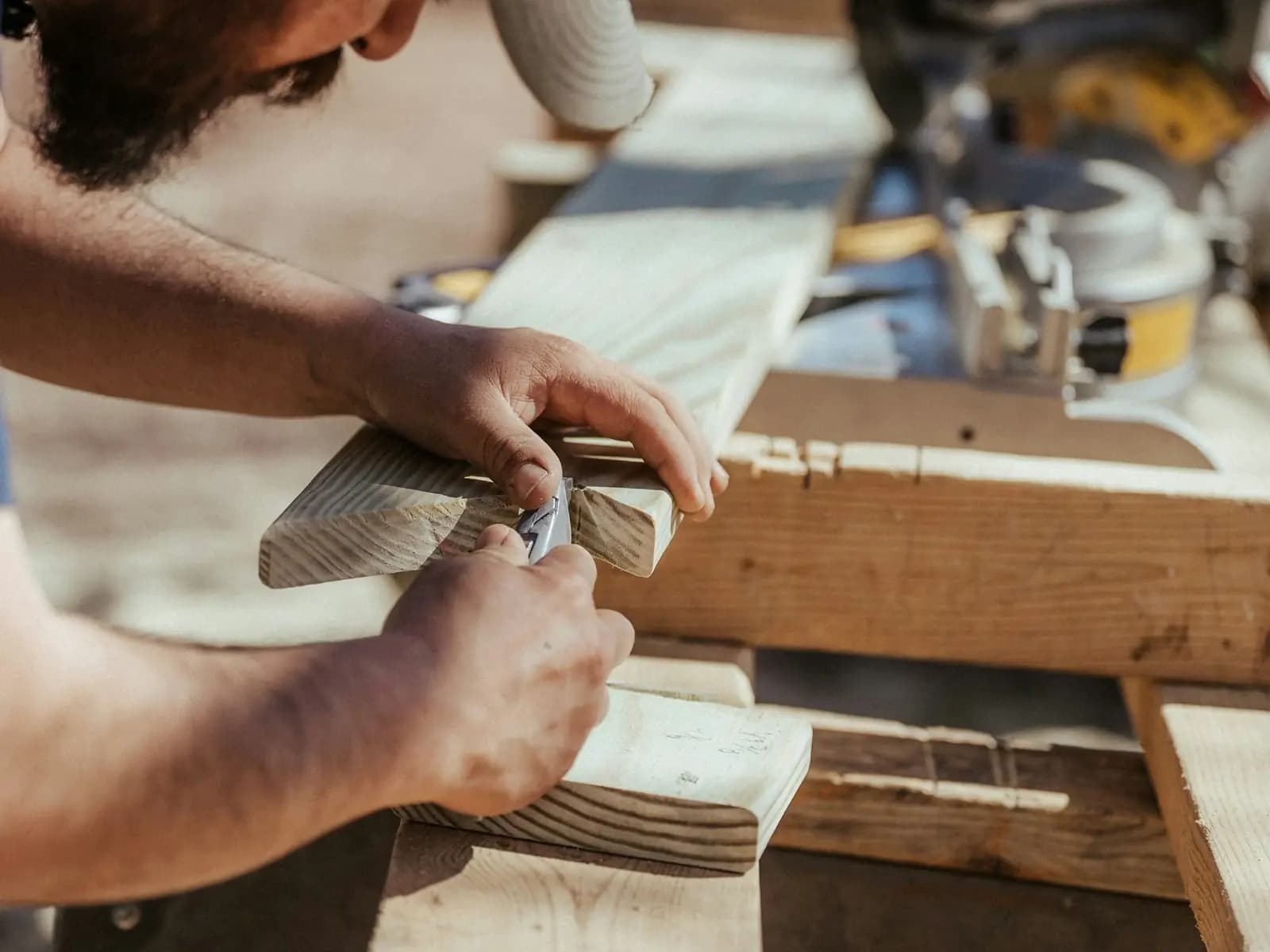 A joiner assembling made-to-order furniture in the OMH Nepal workshop at Machhapokhari